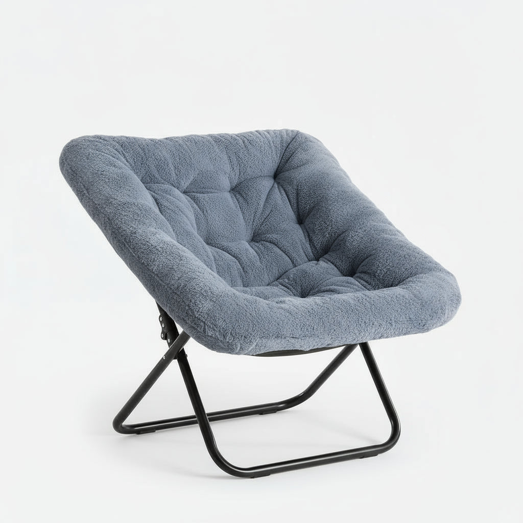 Gray cushioned chair with a black metal frame on a white background