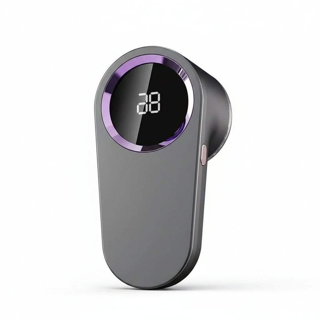 Gray mini hairball trimmer with digital display and charging cable on a dark background