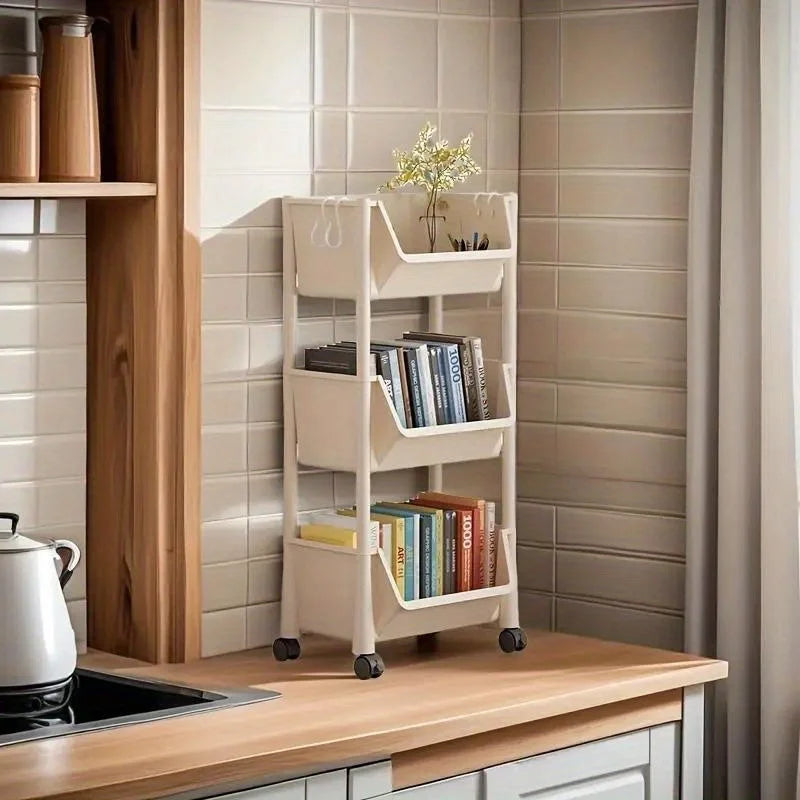 Kitchen shelf with books and a plant against a tiled wall.