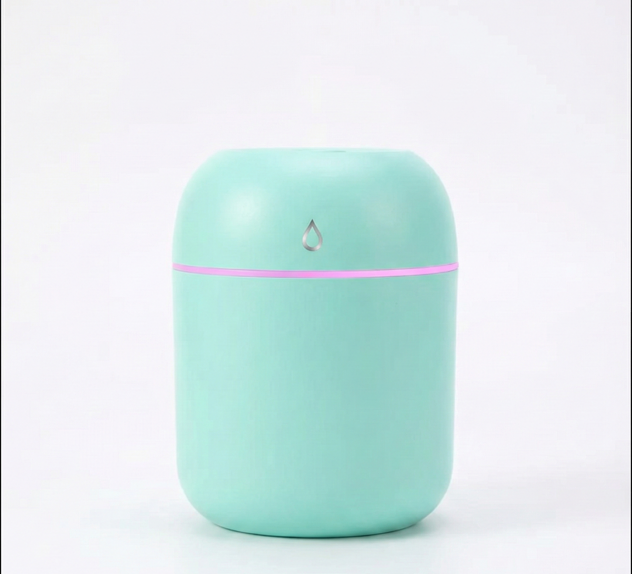 Mint green humidifier with a pink accent on a white background