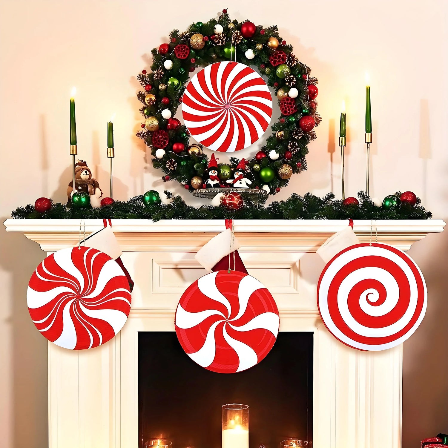 Decorative Christmas wreath with candy cane patterns on a fireplace mantel.