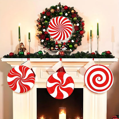 Decorative Christmas wreath with candy cane patterns on a fireplace mantel.