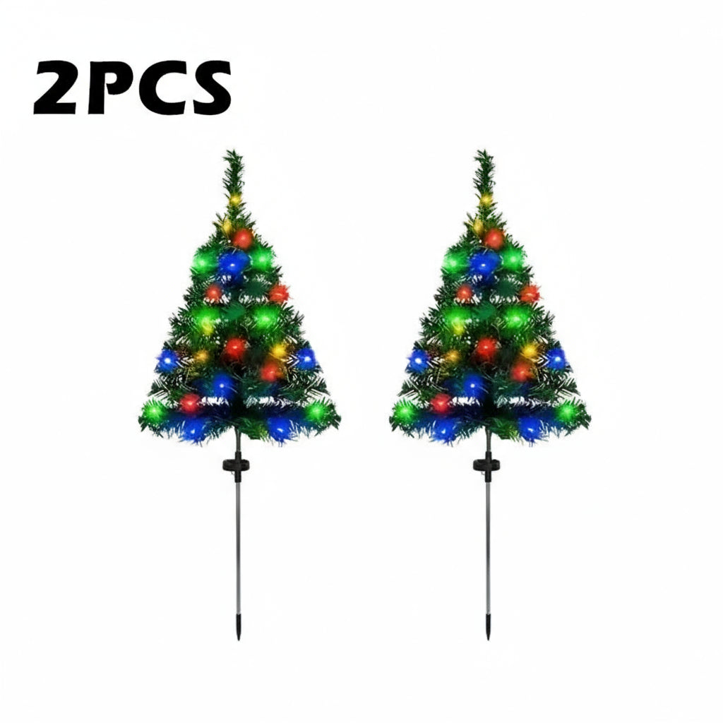 Two small Christmas trees with colorful lights on stands, branded &