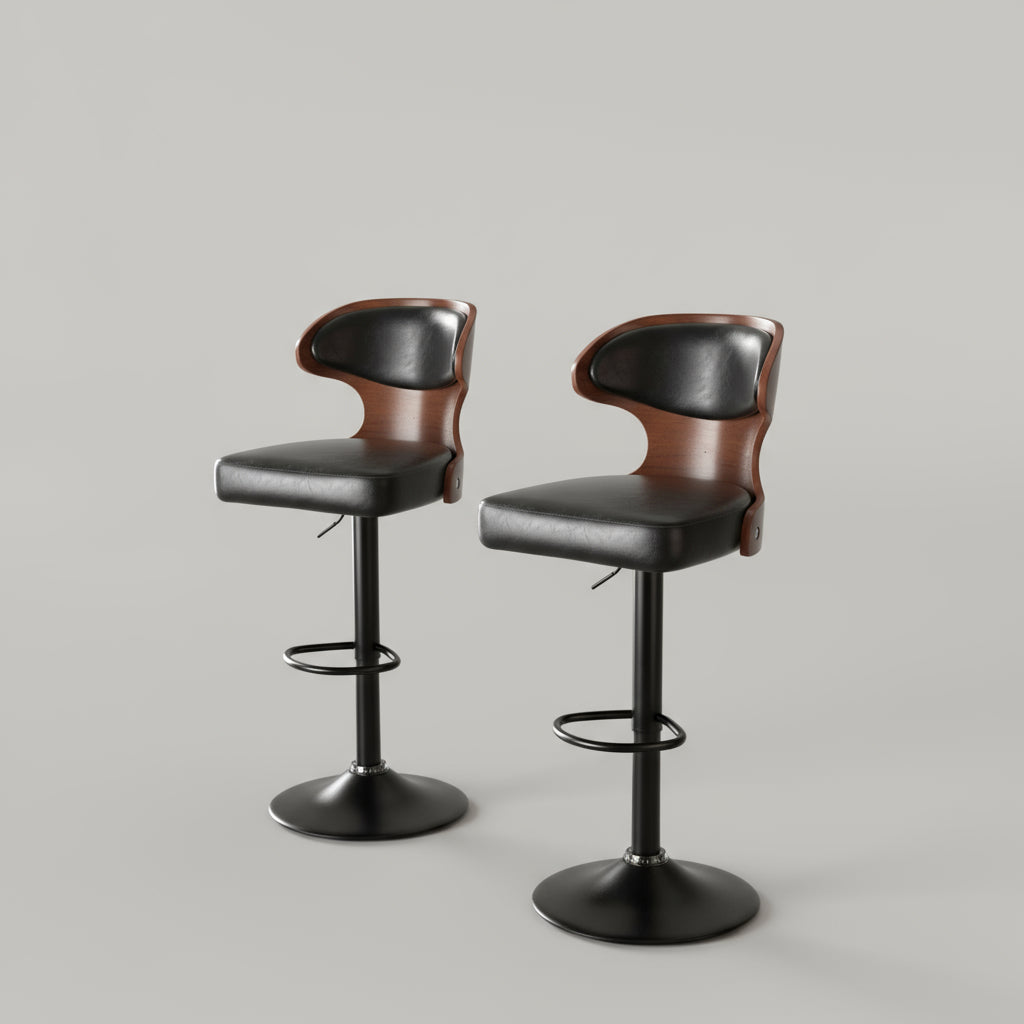 Two black bar stools with brown seats in a modern kitchen setting.
