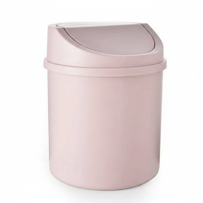 Pink trash can with a white background