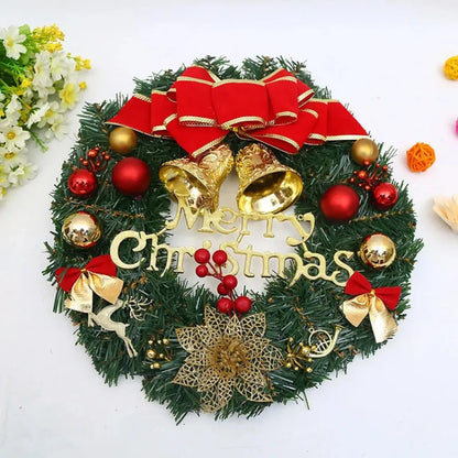 Decorative Christmas wreath with ornaments and a red bow on a white background