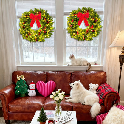 Living room with Christmas wreaths on windows, a dog on a couch, and festive decorations.