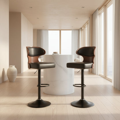 Two bar stools with black seats and wooden backs in front of a white table in a kitchen setting.